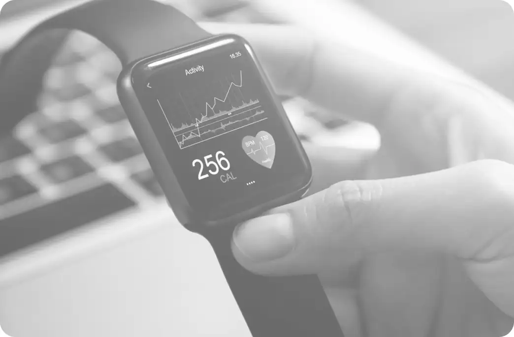 Person looks at an Apple Watch to track heart rate