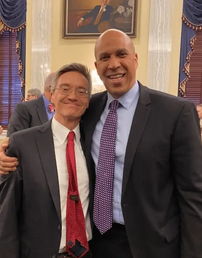 Dr. Kevin Volpp takes a photo with Senator Cory Booker