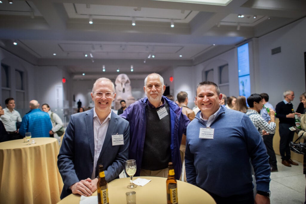 Three speakers/attendees pose for a photo at CHIBE's Behavioral Science and Health Symposium