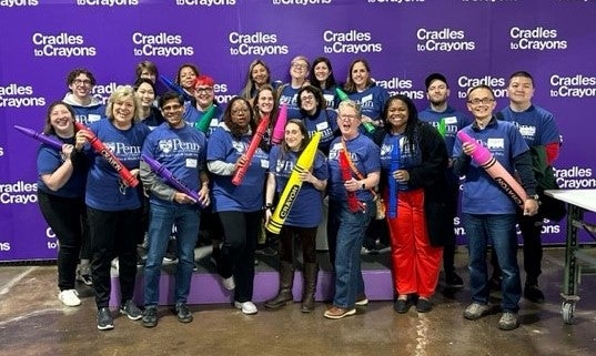 group photo of department volunteering at cradles to crayons