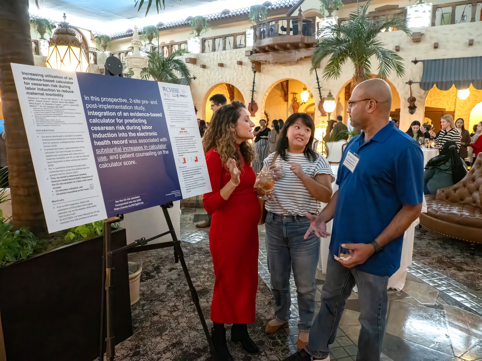 Rebecca Hamm, Adina Lieberman, and Mohan Balachandran talk at poster session