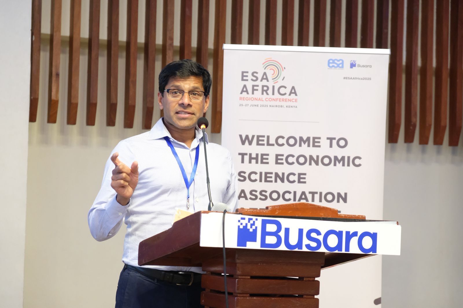 harsha speaking at conference